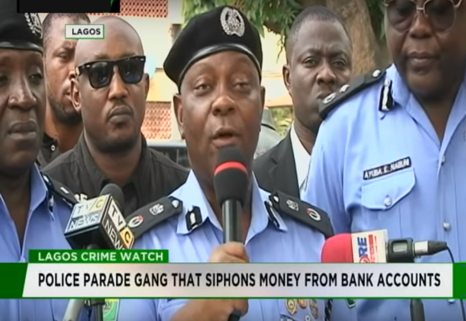 Police are parading gang members for siphoning money from banks through SIM cards